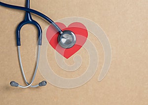 Top view blue stethoscope on yellow background. For check heart or health check up concept