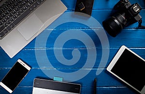 Top view of the blue wooden table. Photographer The desktop