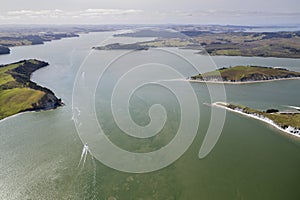 Top view of a boat sailing on clear water in Northland, New Zealand