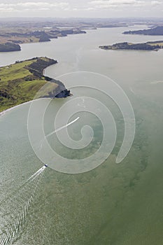 Top view of a boat sailing on clear water in Northland, New Zealand