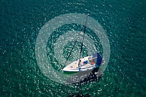 Top view of a boat sailing at the ocean at Chalkidiki, Greece.