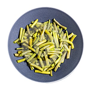 top view of boiled green beans on plate isolated