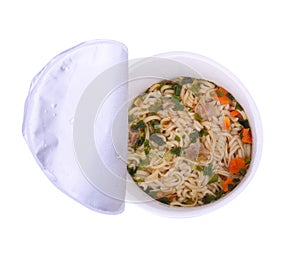 Top view of boiled instant noodles in plastic bowl isolate on wh