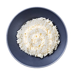 Top view of boiled parboiled rice in gray bowl