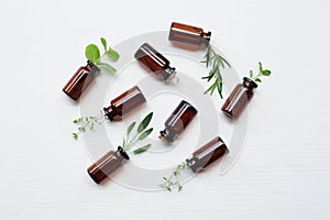 Top view, Bottle of essential oil with herbs sage, rosemary, or