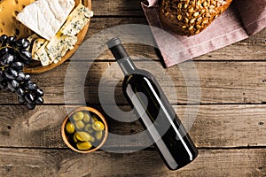 Wine, bread, olives and cheese