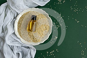 Top view of bottles with sesame seed essential oil