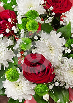 Top view. Bouquet of bright spring flowers of roses and chrysanthemums