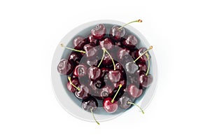 Top View of a Bowl with Cherries on White Background