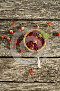 Top view of a bowl of delicious home made strawberry jam or jell