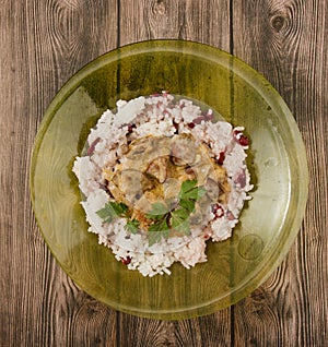 Top view of a bowl of rice with beans and chicken liver