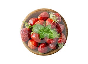 Top view. Bowls with strawberries isolated on white background. Ripe strawberries with a basil leaf close-up. Background berry.