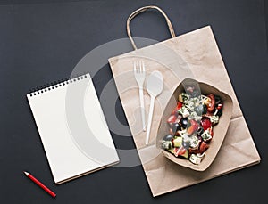 top view box with salad paper bag. High quality photo