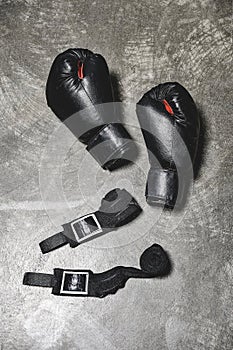 top view of boxing gloves with wrist wraps lying