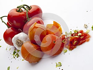 Top view of branch tomatoes a head of garlic and chives 2