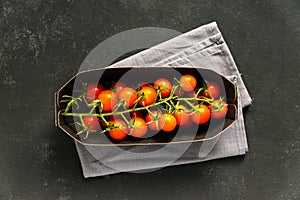 Top view of branch tomatoes in paper package. Food store delivery concept