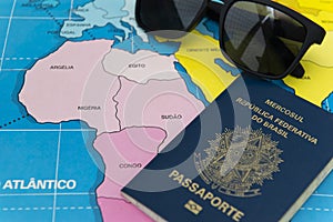 Top view of Brazilian passport over map. Focus on the North American continent. Emigration, travel, destination concept