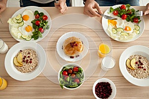 Top view of breakfast table with healthy food for couple