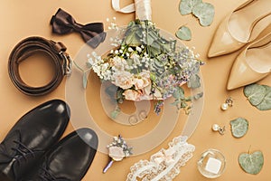 Top view of bride and groom shoes