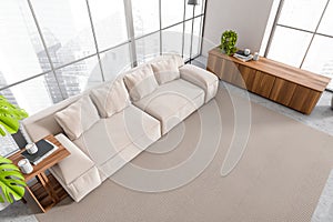 Top view on bright living room interior with sofa