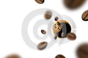 Top view of brown roasted coffee beans falling and flying to coffee cup on white background
