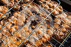 Top view of the browned steaks of red coho salmon fried on charcoal in a barbecue on a summer day in the country. Cooking a