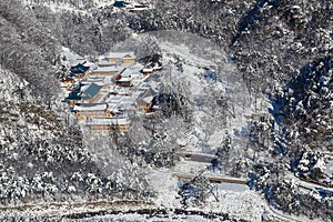 Top View. Buddhist monastery in the middle of a snowy forest in the winter taiga