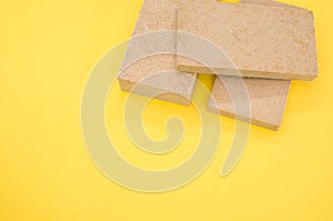 Top view of building thermal insulation materials isolated on yellow background