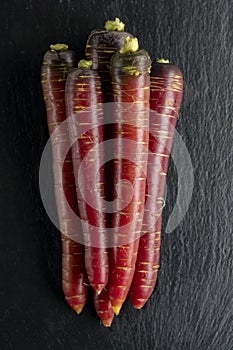 Top view of bunch of fresh organic red carrots. Healthy food