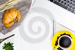 top view business breakfast with coffee and croussant. Rustic white wooden background with copy space