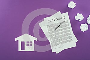 Business contract with pen and house symbol on purple surface