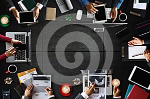 Top view of business Group of Multiethnic Busy People meeting with other in modern office with laptop computer, smartphone, tablet