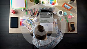 Top view of business man looking for startup idea, writing on paper his thoughts