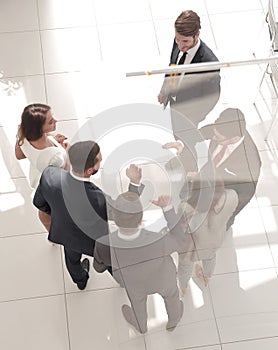 Top view. business partners stretching out their hands for a handshake