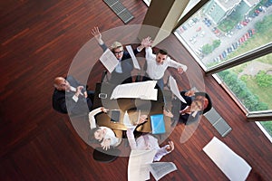 Top view of business people group throwing dociments in air