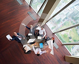 Top view of business people group throwing dociments in air