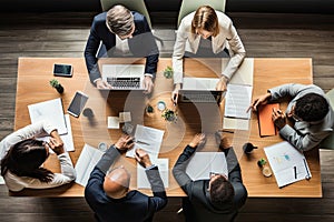 Top view of business people sitting at table and working together in office, Business meeting on a working table, top view, No