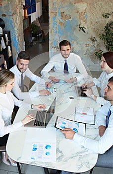 Top view of business people working together while spending time in the office