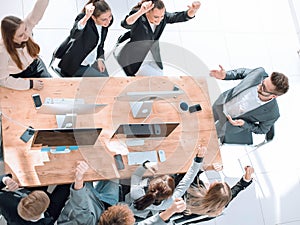 top view. business team applauding at a work meeting