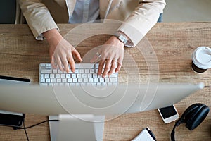 top view of business working desk - working at computer in office.