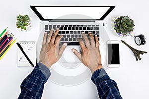 Top view businessman working with modern devices, Man hand on laptop keyboard with blank screen monitor Man hand on laptop