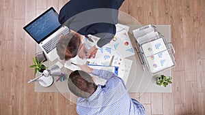 Top view of businessmen working at company strategy analyzing management paperwork