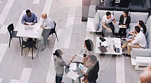 Top view, businesspeople talking and meeting at a conference at their office space. Diversity at work, communication or