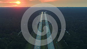 Top view of busy american I-75 freeway in Florida with fast moving traffic at sunset. Interstate transportation concept