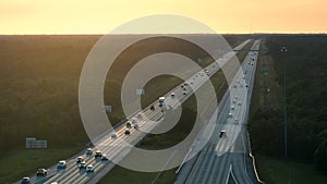Top view of busy american I-75 freeway in Florida with fast moving traffic at sunset. Interstate transportation concept