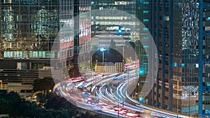 Top view of busy traffic night in finance urban timelapse, hong kong city