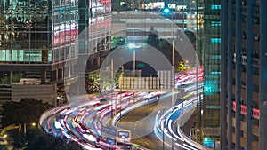 Top view of busy traffic night in finance urban timelapse, hong kong city