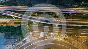 Top view of busy traffic night in finance urban timelapse, hong kong city