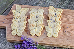 Top View on Butter biscuits cookies with lavender on an oak chop