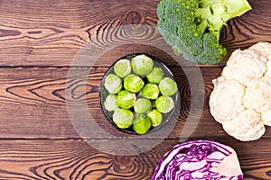 Top view on cabbage, broccoli, cauliflower, Brussels sprouts and red cabbage -ingredients for vegetarian dishes